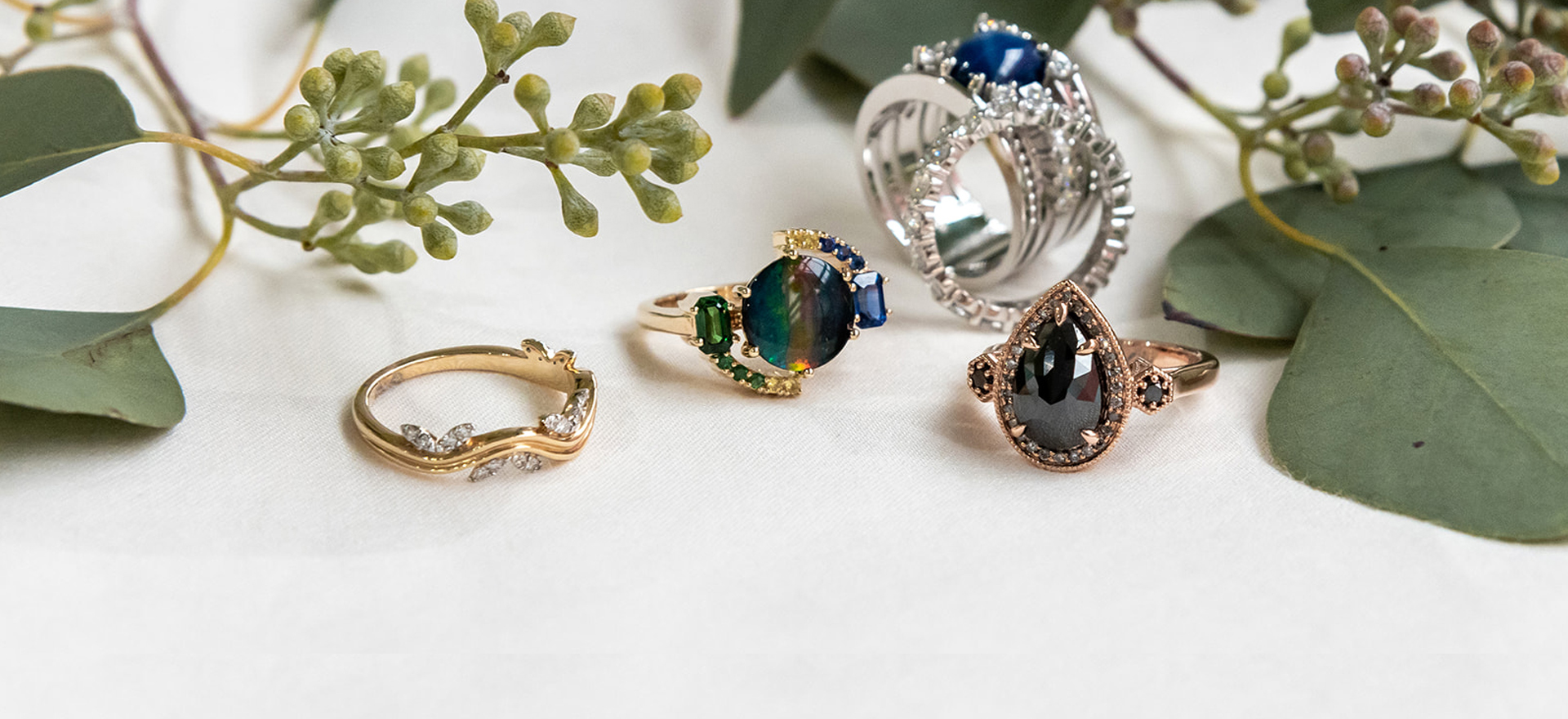 Cluster of bespoke gemstone rings