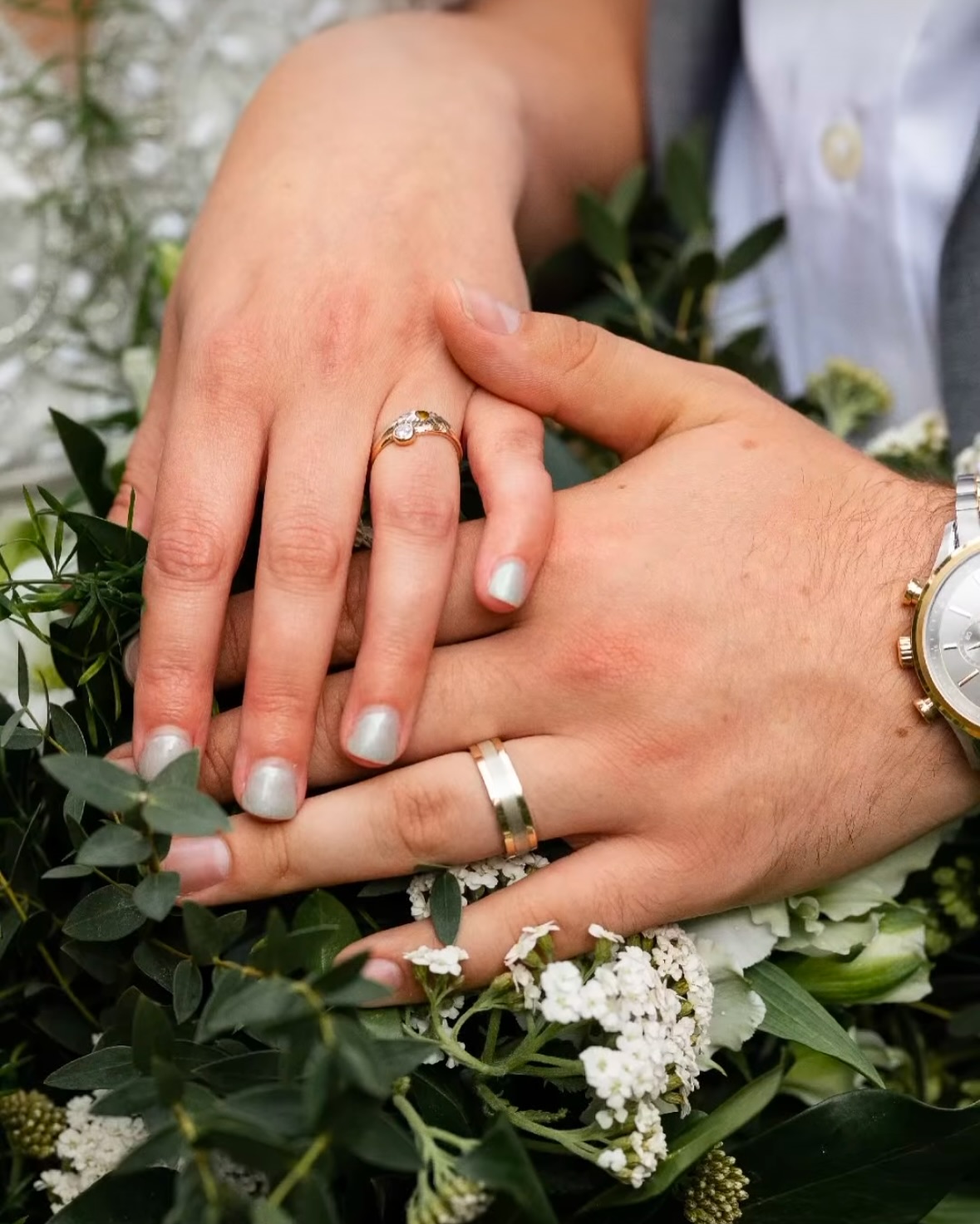 Couple wearing their wedding rings