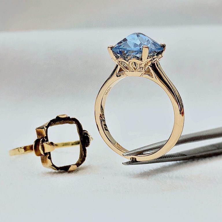 A topaz ring beside the wax model it was carved from