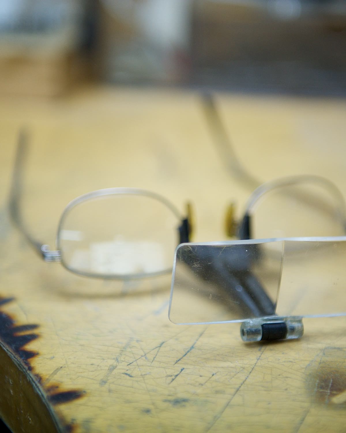 Jeweller's magnifying glasses on the workbench