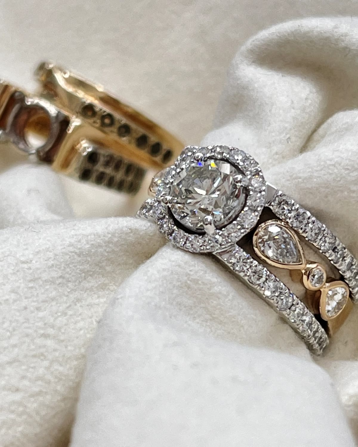 Redesigned heirloom ring with the original ring in the background